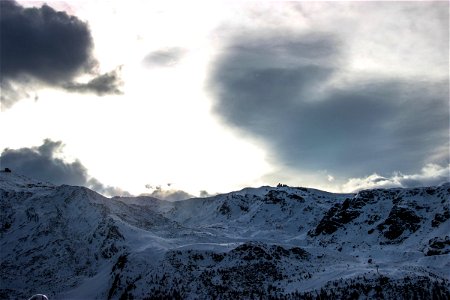 Bright & Dark Clouds Above Mountain Ridge