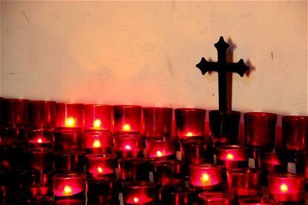 Red Candles in Front of Cross photo
