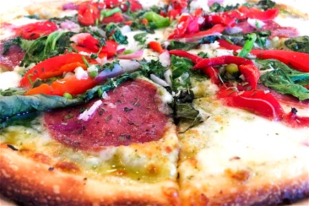 Close Up of Pepperoni Pizza with Vegetables photo