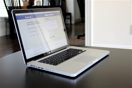 Macbook Laptop Opened to Facebook photo