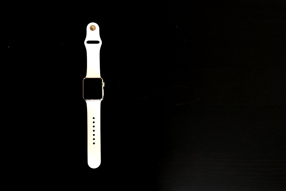 White Apple Watch on Black Table