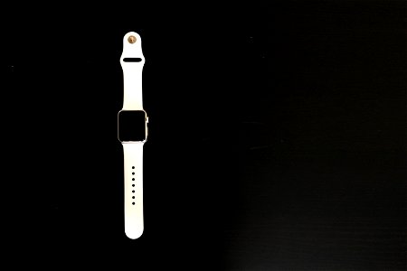 White Apple Watch on Black Table photo