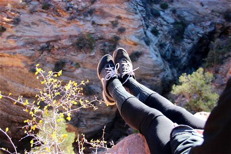 Feet Hanging Over Cliff Edge