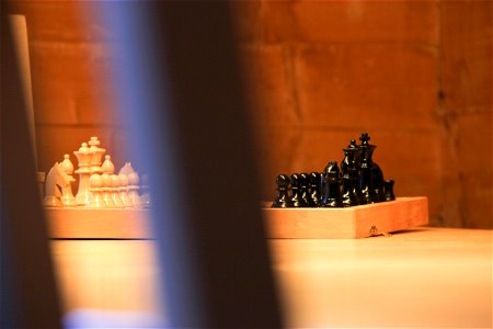 Black & White Chess Pieces on Table photo