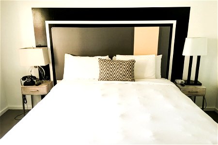 White Bed in Black & White Hotel Bedroom photo