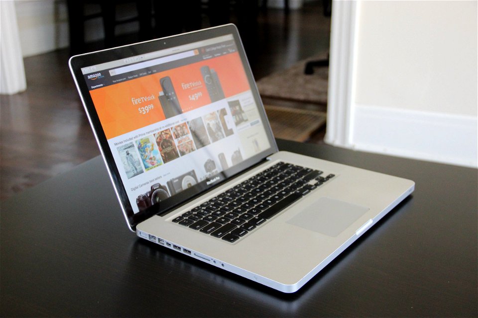 Macbook Laptop on Table Opened to Amazon