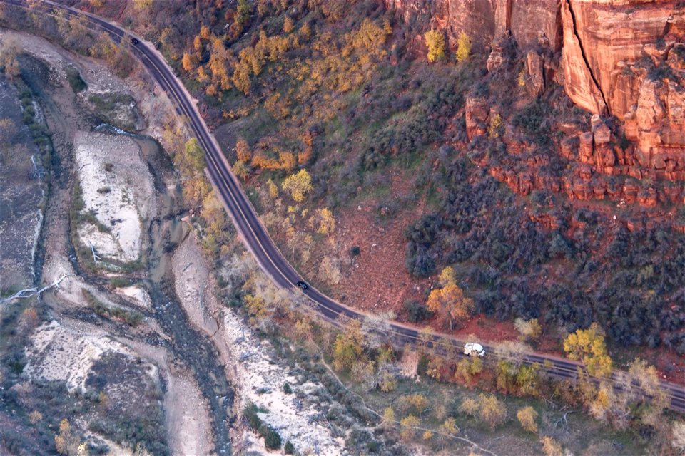 Aerial View of Cars Driving on Road in Canyon photo