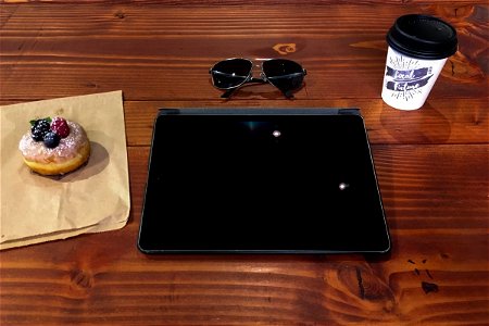 iPad & Coffee on Wood Table photo