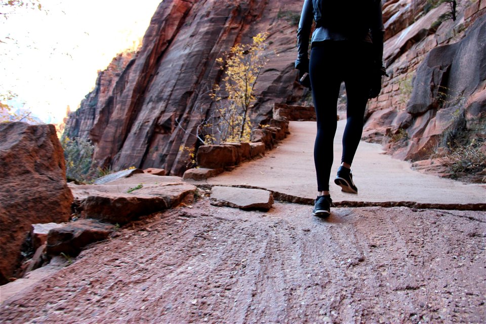 Woman Walking Up Path by Cliffs photo