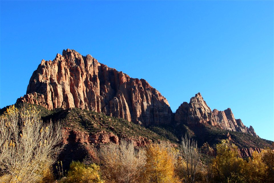 Jagged Rock Mountains Under Blue Sky photo