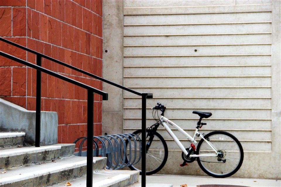 Bicycle Parked by Stairs photo