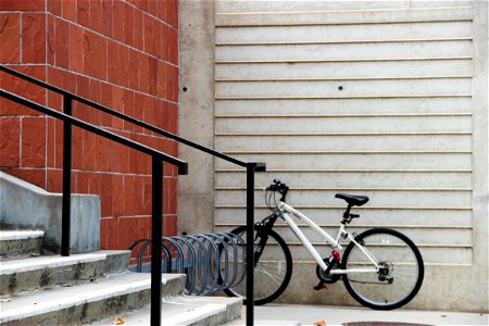 Bicycle Parked by Stairs photo