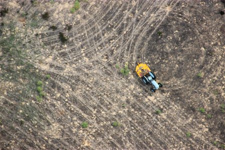Aerial View of Tractor on Dirt photo