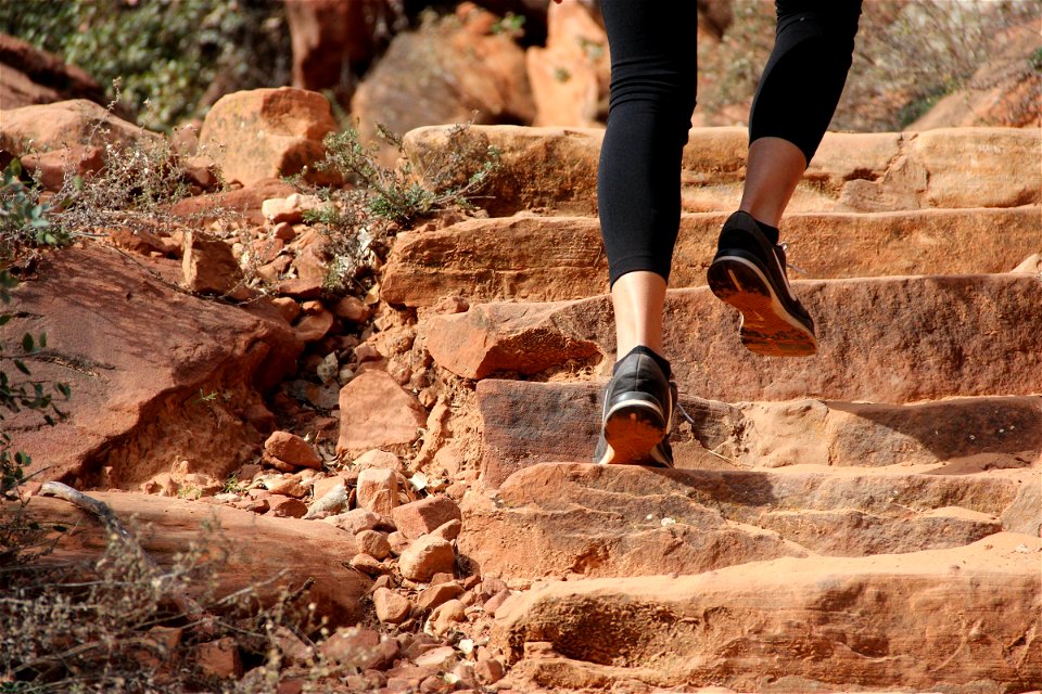 Feet Climbing Up Rock Steps