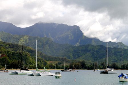 Boats on Water by Tropical Mountains photo