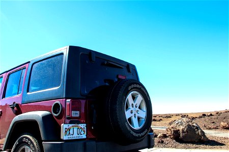 Back of Red Jeep Wrangler in the Desert photo