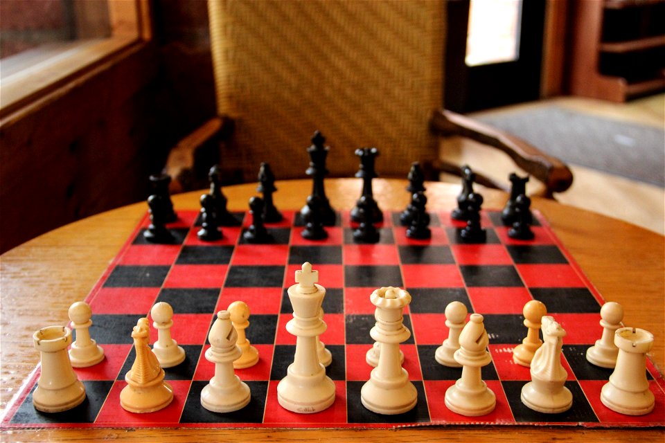 Chess Board on Table with Chair photo