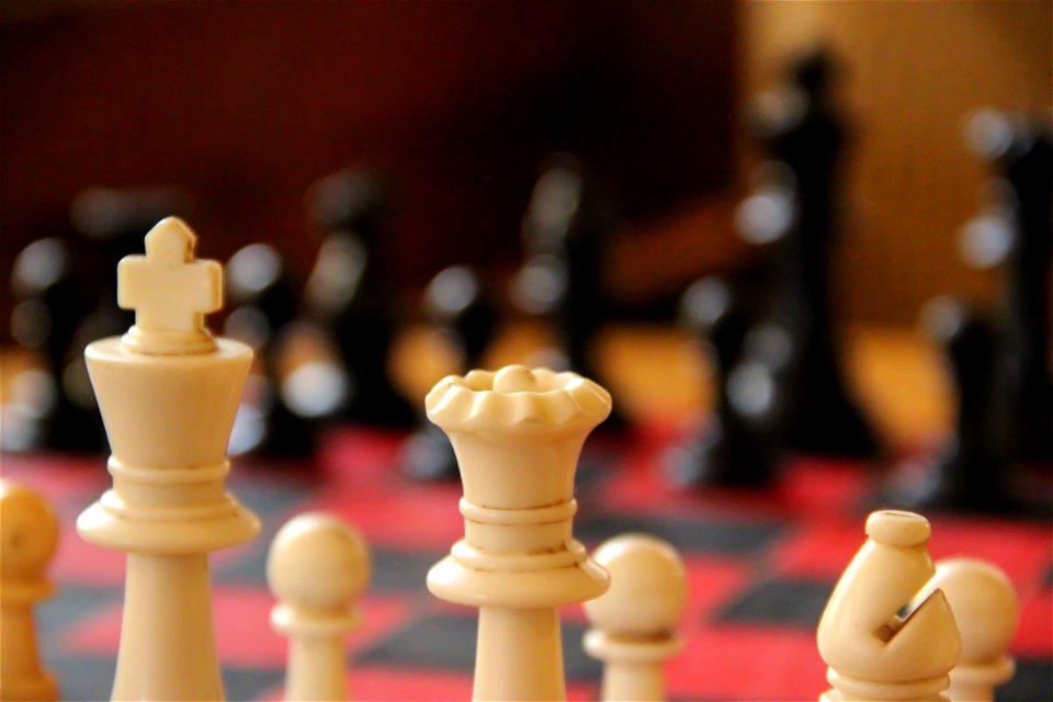 Close Up of Chess Pieces on Chess Board photo