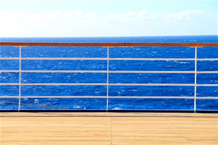 Railing & Deck of a Ship on the Ocean photo