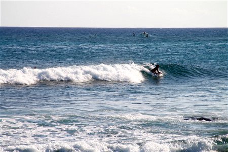 Man Riding Boogie Board on Wave photo