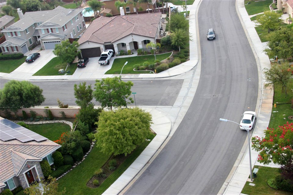 Cars on Curved Neighborhood Street photo