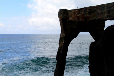 Concrete Structure Over Ocean Waves photo