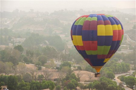 Hot Air Balloon Floating Above Countryside photo