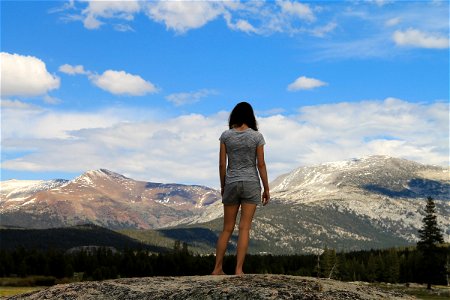 Woman Standing & Looking at Mountains photo