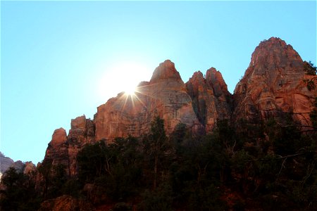 Sun Rising Over Jagged Rock Mountains photo