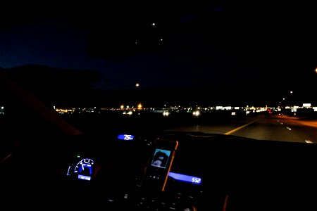 Dashboard of Car Driving at Night photo