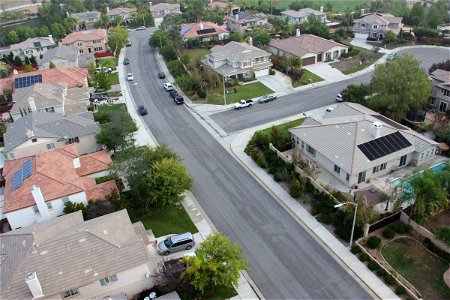 Aerial View of Curved Street Through Neighborhood photo