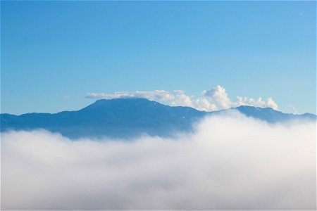 Mountains Rising Above Clouds