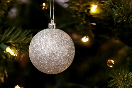 Silver Ball Ornament on Christmas Tree photo