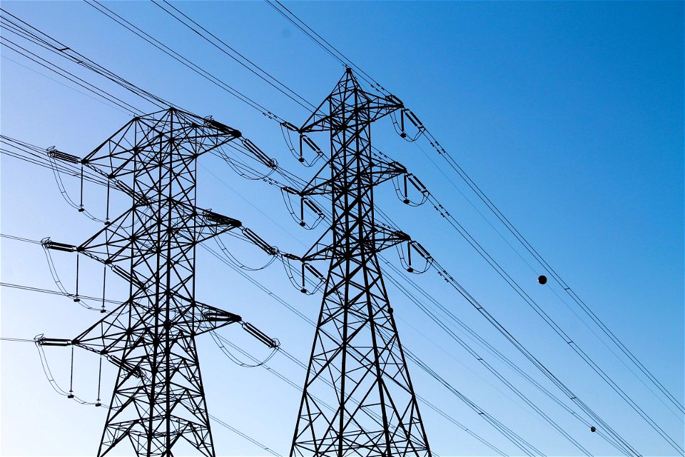Electric Towers with Power Lines in Blue Sky