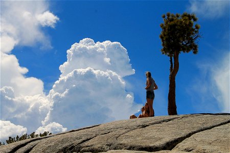 Girls on Rock with Clouds photo