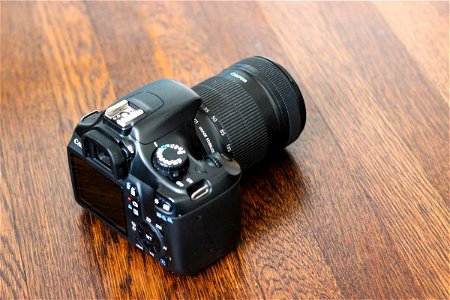 Canon DSLR Camera on Wooden Table