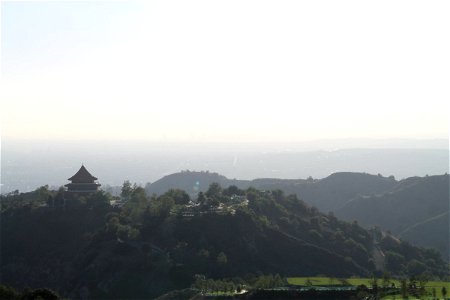 Temple on Hills with City in Background photo