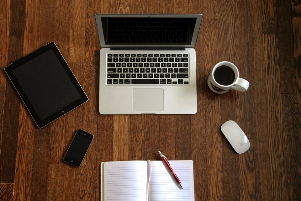 Macbook Laptop with Devices & Accessories on Wooden Desk