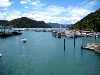 Boats in the Harbor Surrounded by Hills photo