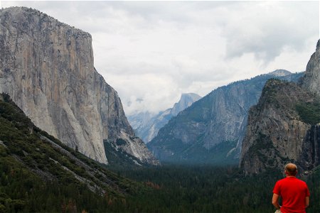 Man Gazing at Mountains & Valley photo