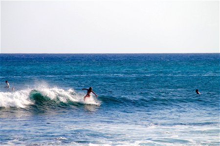 Surfer Boy Riding Wave photo