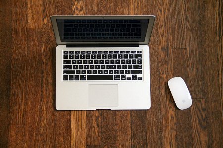 Macbook Air & Mouse on Wooden Desk