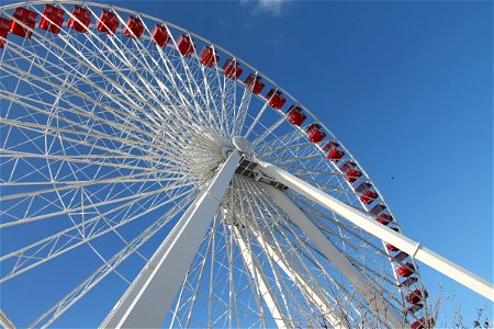 Large Red & White Ferris Wheel in Blue Sky