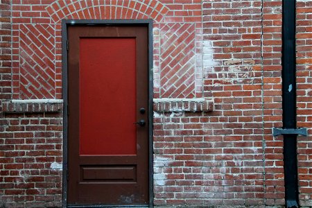 Red & Brown Door on Brick Building