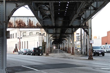 Rusted Metal Bridge Over Street