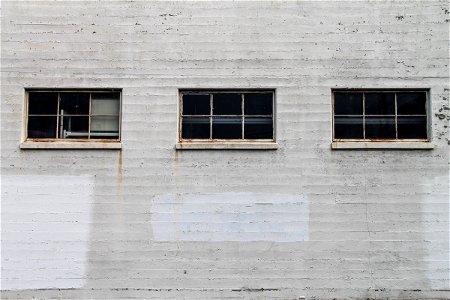 3 Windows on White Brick Building photo