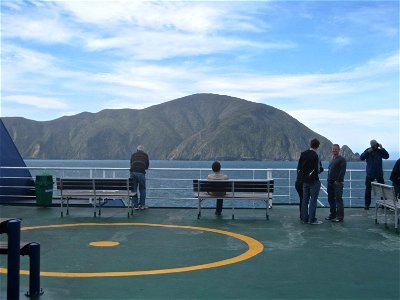 People Standing on Deck of Boat photo