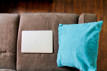 Macbook Laptop on Sofa photo