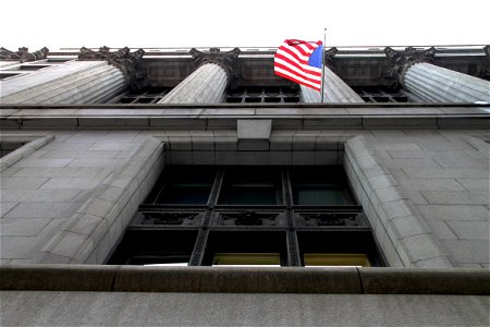 American Flag on Side of Building with Columns photo