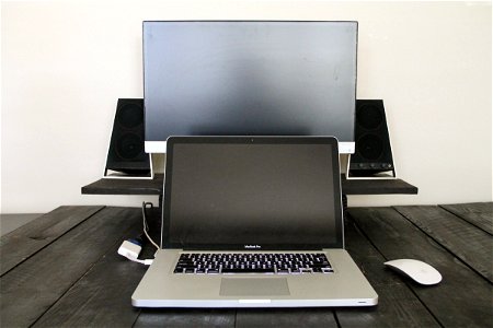 Laptop with Monitor & Speakers on Desk photo